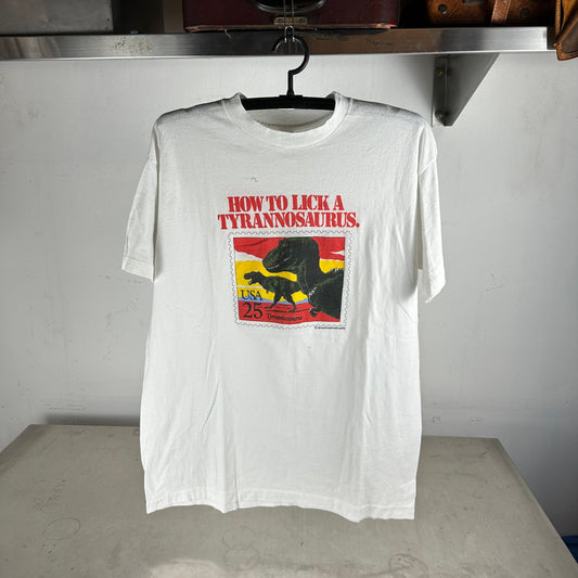 Vintage 1989 USPS How To Lick a Tyrannosaurus Stamps Graphic T-shirt