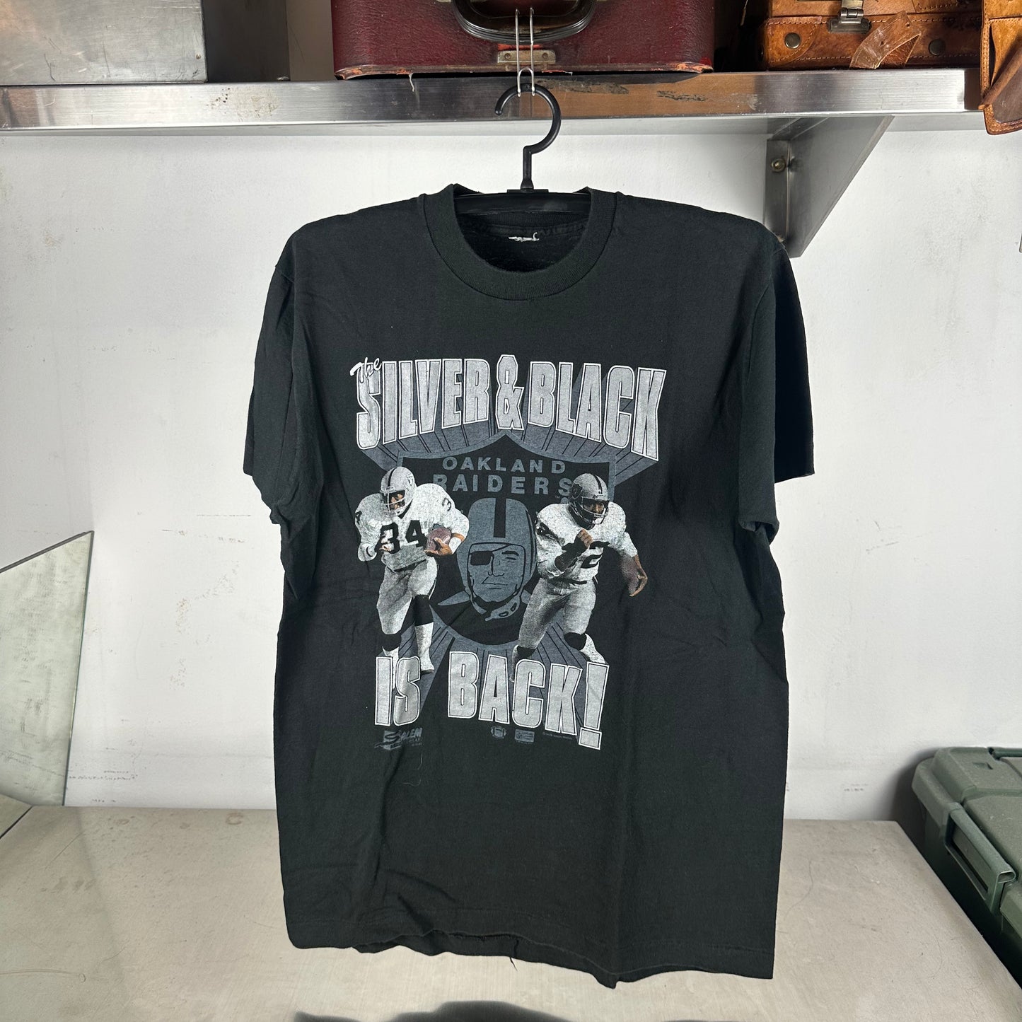 Vintage 1990 Oakland Raiders NFL The Silver &amp; Black is Back! T-shirt
